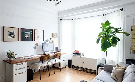 Decorated home office with natural light.