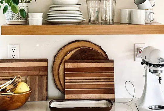 Kitchen design decoration with wooden cutting boards and dishes.